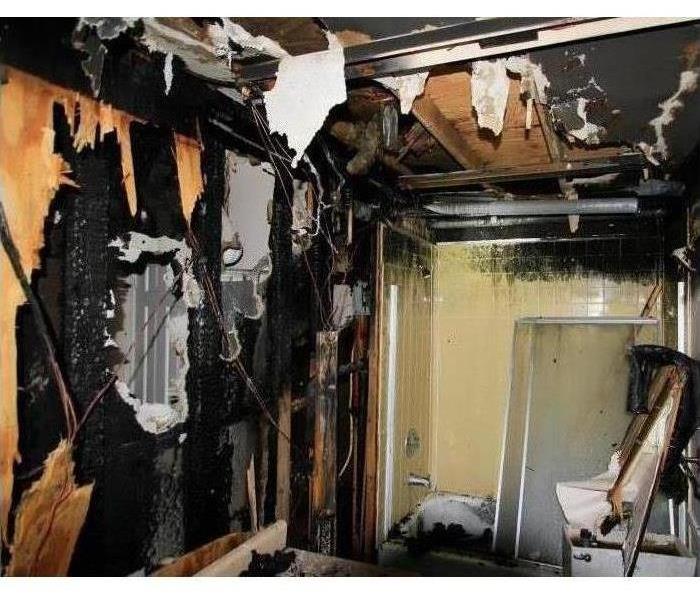 Fire Damage In Bathroom exposing studs